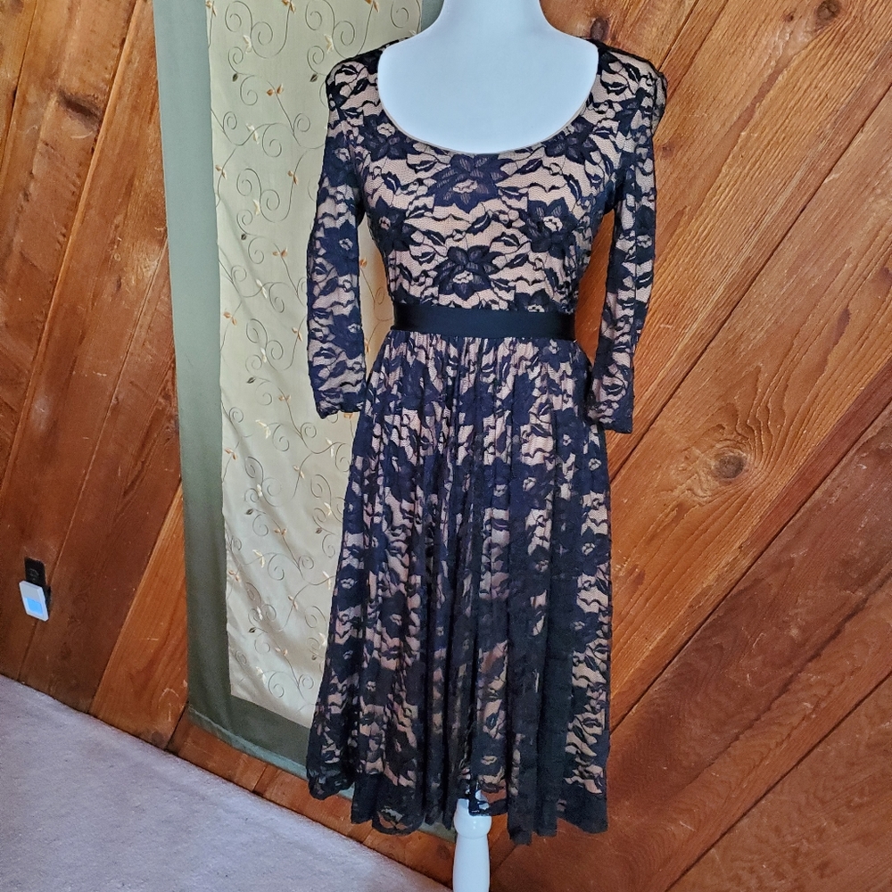 Lace overlay dress with ribbon waist. MarcBouwer label.